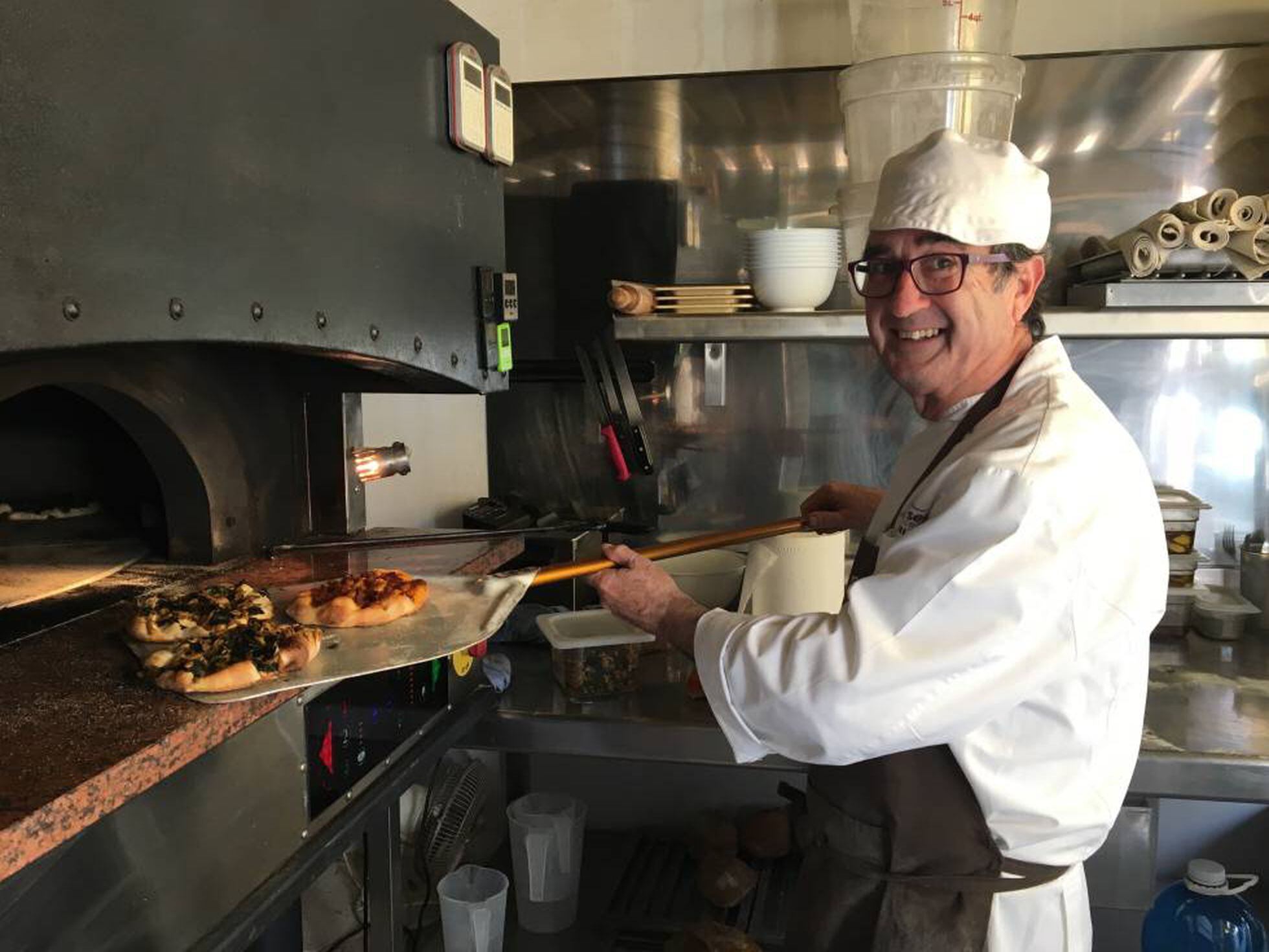 Chef preparing food in a restaurant kitchen in Dénia