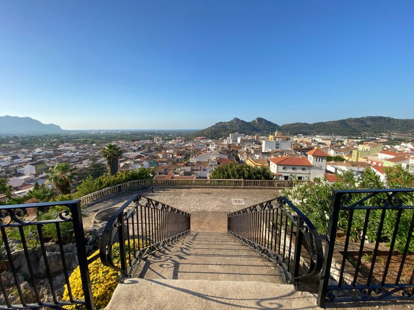 Stone staircase overlooking Pedreguer town with mountain views