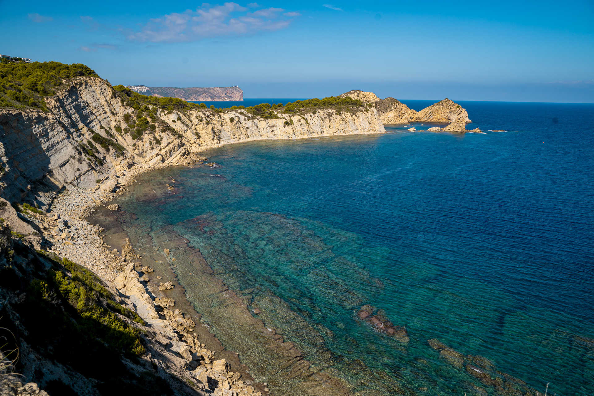 Aerial view of Jávea coastline with cliffs and blue sea