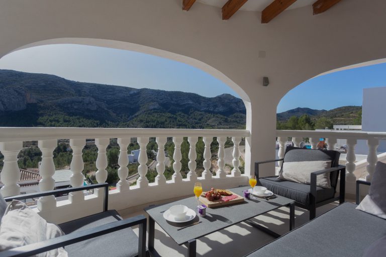 Outdoor terrace with mountain views at Villa Vino in Pedreguer