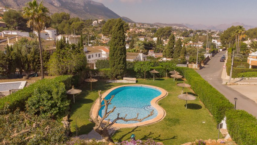 Communal swimming pool at Montesol in Dénia surrounded by gardens
