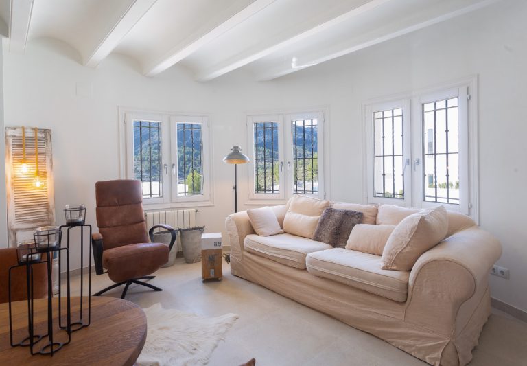 Living room with sofa and natural light at Villa Vino in Pedreguer