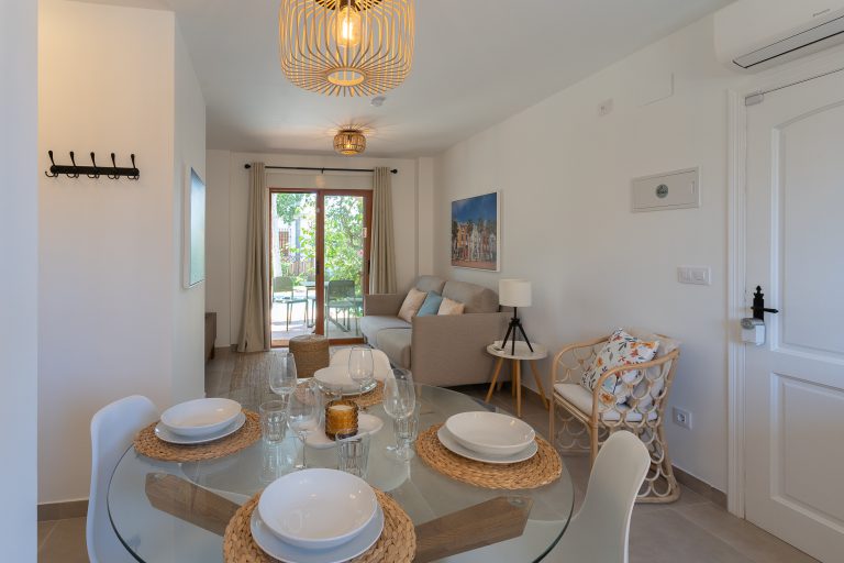 Living room and dining area at apartment El Patio in Dénia