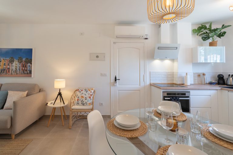 Living room and dining area at apartment El Patio in Dénia