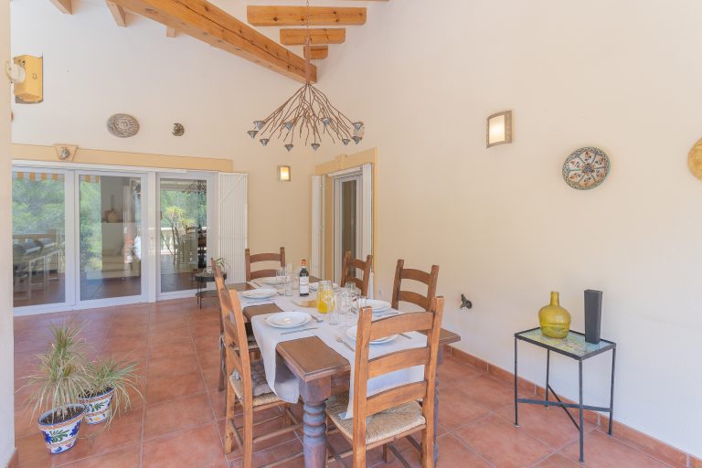 Dining area with open living space at Villa Casa Joni in Orba
