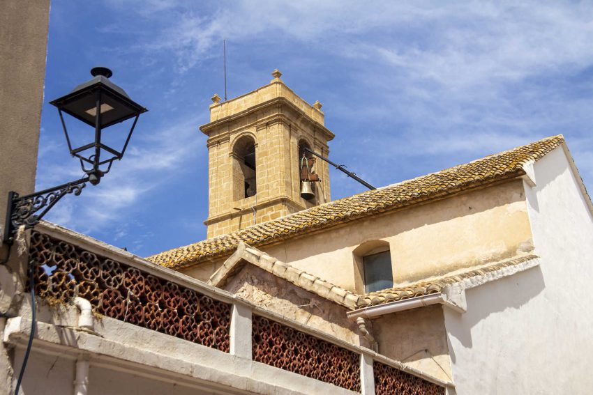 Church tower in Orba village with Mediterranean architecture