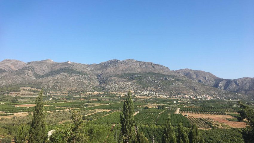 Valley landscape near Orba with mountains and green countryside