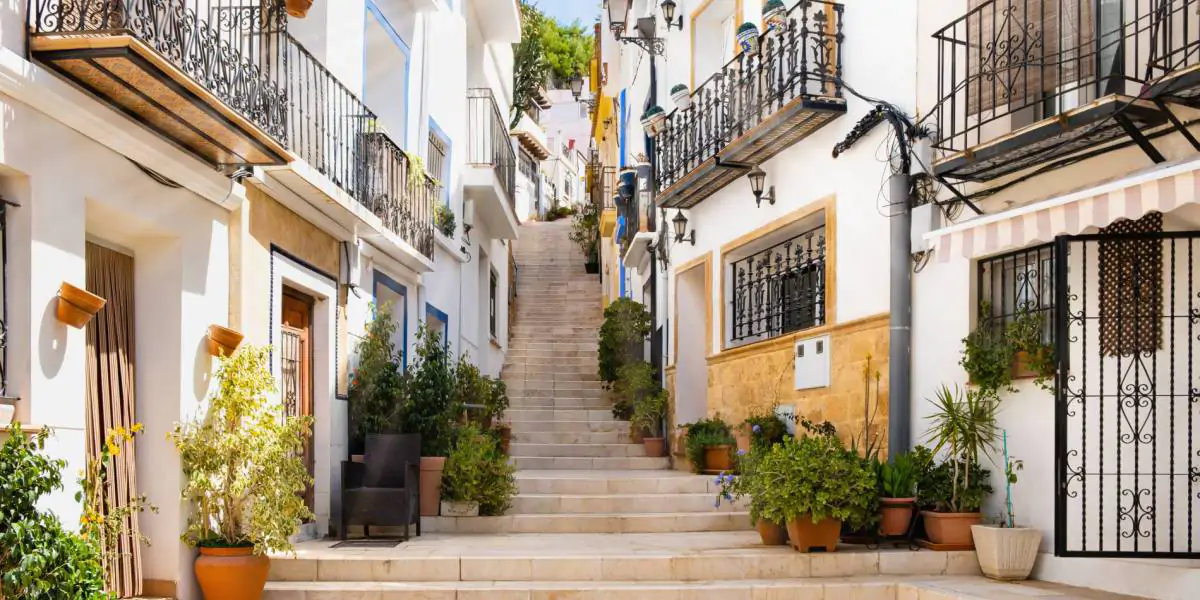 Historic street in the old town of Jávea with traditional Spanish architecture on the Costa Blanca.