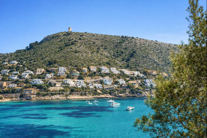 Coastline of Jávea on the Costa Blanca North with turquoise sea and hillside homes